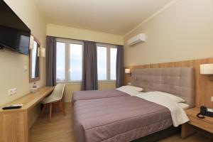 Voodi või voodid majutusasutuse Hotel Hermes toas