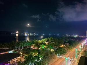 an aerial view of a city at night at Anh Minh - Manchester Hotel Tran Phu Beach Nha Trang in Nha Trang +38 photos