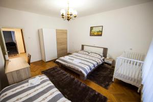 En eller flere senger på et rom på Apartman Kuća 150