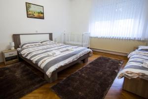 Postel nebo postele na pokoji v ubytování Apartman Kuća 150