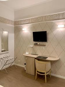 TV a/nebo společenská místnost v ubytování Hotel La Pace