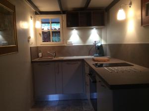 A kitchen or kitchenette at Sous les Canniers