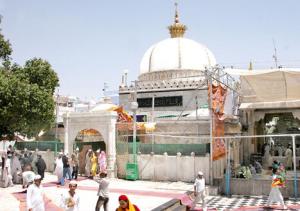a group of people walking in front of a mosque at Hotel Raj Inn Ajmer Sharif in Ajmer