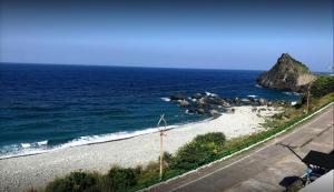 a view of a beach with rocks and the ocean at Banai Homestay in Lanyu