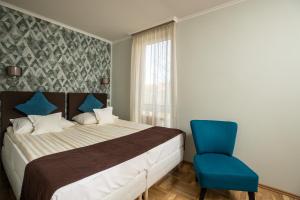 Postelja oz. postelje v sobi nastanitve Dóm Hotel