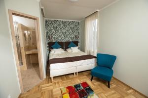 Postelja oz. postelje v sobi nastanitve Dóm Hotel