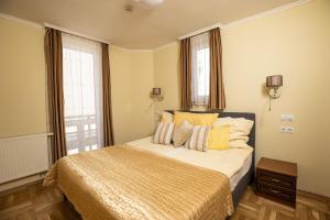 Postelja oz. postelje v sobi nastanitve Dóm Hotel