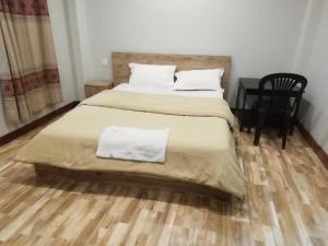 Postel nebo postele na pokoji v ubytování Manaslu Homestay