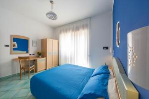 Ένα ή περισσότερα κρεβάτια σε δωμάτιο στο La Casa Delle Stelle