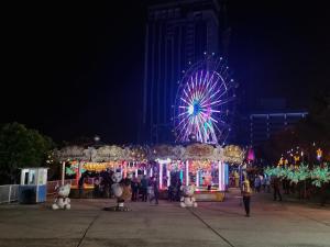 a carnival with a ferris wheel at night at A's House i-City 1-4pax Studio Netflix Wifi in Shah Alam +26 photos