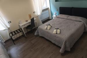 Postel nebo postele na pokoji v ubytování Maison Gentile