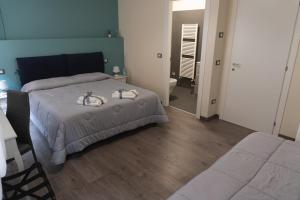 Postel nebo postele na pokoji v ubytování Maison Gentile
