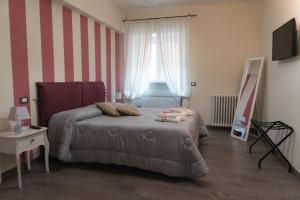 Postel nebo postele na pokoji v ubytování Maison Gentile