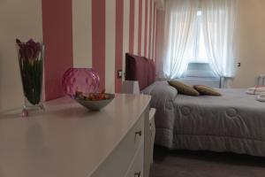 Postel nebo postele na pokoji v ubytování Maison Gentile