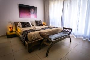 En eller flere senge i et værelse på Can Olivo - Acogedora casa con exclusivo diseño interior