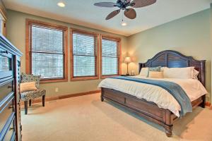 a bedroom with a bed and a ceiling fan at Lakefront Giants Ridge Retreat Near Ski and Golf! in Biwabik