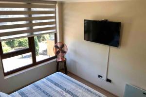 TV a/nebo společenská místnost v ubytování Departamento en Edificio Costanera Playa Villarrica