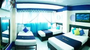 Postel nebo postele na pokoji v ubytování Hotel Luna Azul