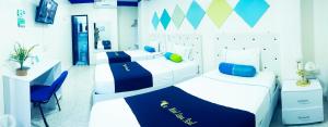 Postel nebo postele na pokoji v ubytování Hotel Luna Azul