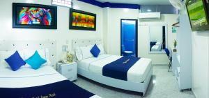 Postel nebo postele na pokoji v ubytování Hotel Luna Azul
