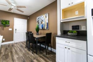 a kitchen and dining room with a table and chairs at Long Beach Duplex King Bed Pet Friendly Nurses Surgeon Business Travelers Near St Marys Medical Center & Downtown in Long Beach