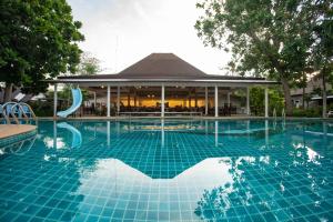 a swimming pool with a gazebo at Southern Lanta Resort - SHA Extra Plus in Ko Lanta