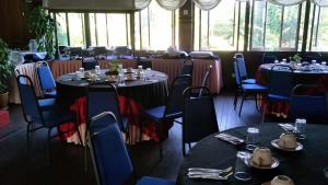 a dining room with tables and chairs in a room at Motel Desa in Kuala Terengganu