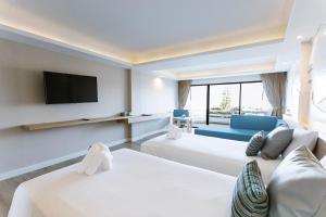 Postel nebo postele na pokoji v ubytování Methavalai Hotel