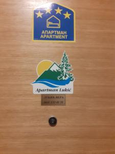 a door with an airport apartment sign on it at Apartman Lukić in Zlatibor