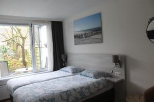 Postel nebo postele na pokoji v ubytování B&B Papillon