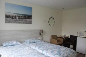 Postel nebo postele na pokoji v ubytování B&B Papillon