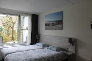 Postel nebo postele na pokoji v ubytování B&B Papillon