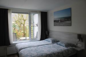 Postel nebo postele na pokoji v ubytování B&B Papillon