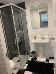 a bathroom with a sink and a shower at Bello Horizonte Frontbeach in Salou +29 photos