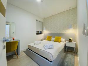 Łóżko lub łóżka w pokoju w obiekcie Family Hostel Costa Nova