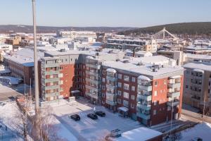 an aerial view of a city with buildings at Tuomas´ luxurious suites, Kaakkuri in Rovaniemi