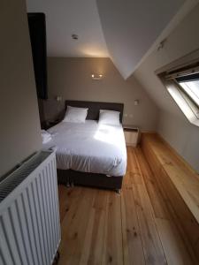 Letto o letti in una camera di Family Hôtel