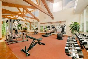 an indoor gym with treadmills and exercise bikes at Albatroz Beach & Yacht Club in Santa Cruz