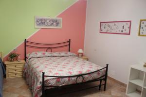 A bed or beds in a room at Villa Lucia B&B
