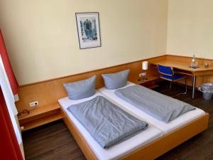 Postel nebo postele na pokoji v ubytování Münchner Hofbräu Coburg + 2 fotografie