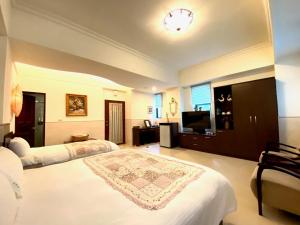 Postel nebo postele na pokoji v ubytování Ho Feng Private Hotel 電梯自助民宿