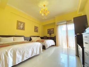 Postel nebo postele na pokoji v ubytování Ho Feng Private Hotel 電梯自助民宿