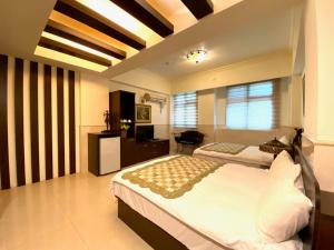 Postel nebo postele na pokoji v ubytování Ho Feng Private Hotel 電梯自助民宿