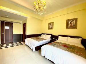 Postel nebo postele na pokoji v ubytování Ho Feng Private Hotel 電梯自助民宿