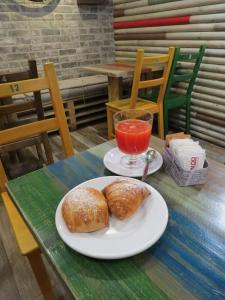 a table topped with a plate of food next to a cup of coffee at L'arco e il vico in Naples