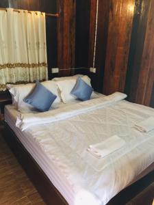 Postel nebo postele na pokoji v ubytování Nan View Farmmer Lumduan Homestay