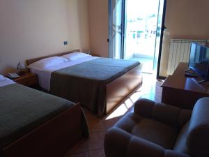 Voodi või voodid majutusasutuse Hotel Sassacci toas