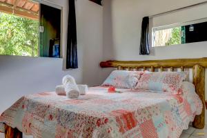Cama ou camas em um quarto em Pousada Residenzial Cariocare