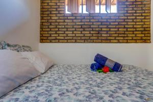 Cama ou camas em um quarto em Pousada Residenzial Cariocare