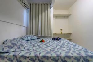Cama ou camas em um quarto em Pousada Residenzial Cariocare